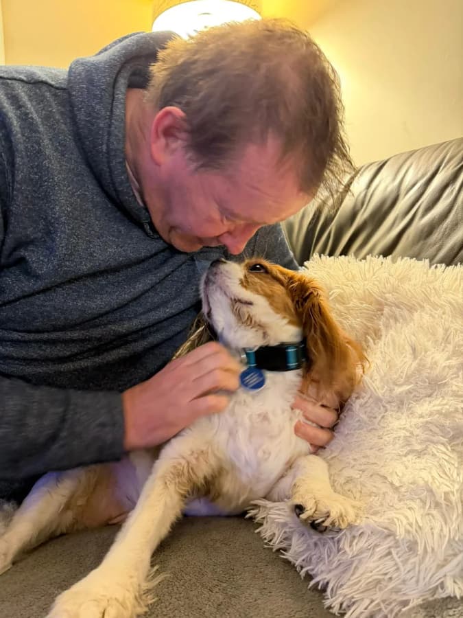 A home boarder sharing a quiet moment with a golden dog