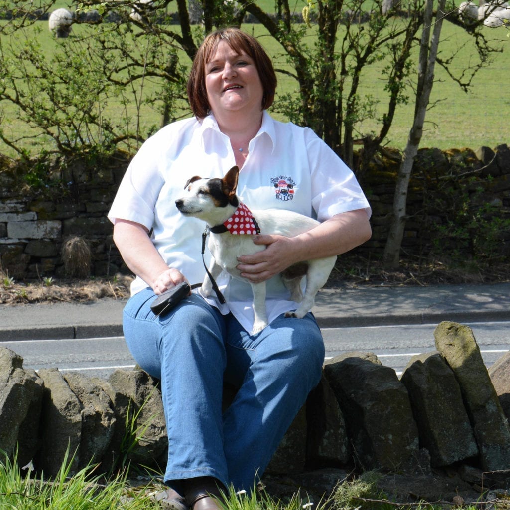 Seana sitting outdoors with her Jack Russell, Jack